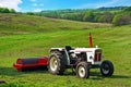 A white tractor in the fields