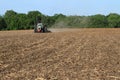 White Tractor Tilling Field Royalty Free Stock Photo