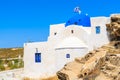 White traditional Greek church in Monastiri bay on Paros island, Greece Royalty Free Stock Photo