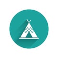 White Traditional indian teepee or wigwam icon isolated with long shadow. Indian tent. Green circle button. Vector Royalty Free Stock Photo