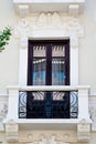 White and wooden traditional window and balcony in Spain with stucco decoration Royalty Free Stock Photo