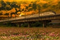 White train passing through cement viaduct landscape. Royalty Free Stock Photo