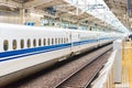 White train at the railway station in Kyoto, Japan. Copy space for text. Royalty Free Stock Photo