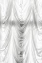 White translucent curtain with flounces on the window