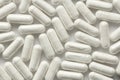 White Transparent Capsules or Tablets on the White Background. M