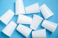 White transparent disposable plastic cups on the blue background Royalty Free Stock Photo