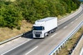 White Transportation Truck on country highway on a bright day Royalty Free Stock Photo