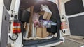 A white transporter van filled with house clearance household rubbish Royalty Free Stock Photo