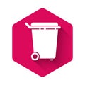 White Trash can icon isolated with long shadow. Garbage bin sign. Recycle basket icon. Office trash icon. Pink hexagon