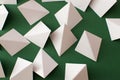 White triangle shapes on green background