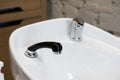 White triple hair washing sink for hairdresser salon closeup