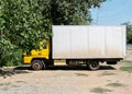 White truch parked near tree side view Royalty Free Stock Photo