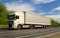 White truck on asphalt road under blue sky with clouds. Royalty Free Stock Photo