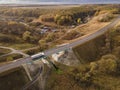 White Truck with Cargo Semi Trailer Moving on Highway Road intersection junction. Aerial Top View Royalty Free Stock Photo