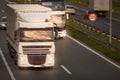 White truck in motion blur and bus on highway Royalty Free Stock Photo