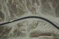 A white truck runs on the pan-American Highway through Nazca desert in Peru. Royalty Free Stock Photo