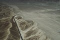 A white truck runs on the pan-American Highway through Nazca desert in Peru. Royalty Free Stock Photo