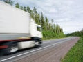 White truck speeding on rural highway, motion blur Royalty Free Stock Photo