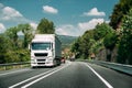 White Truck Or Tractor Unit, Prime Mover, Traction Unit In Motion On Road, Freeway. Asphalt Motorway Highway Against Royalty Free Stock Photo