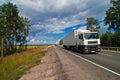 White trucks traveling on the highway