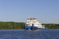 White tug pusher floats at full speed along the river Royalty Free Stock Photo