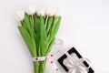 White tulip flowers and black gift box on light background flat lay. Place for text 8 March Happy Womens Mothers Day Royalty Free Stock Photo