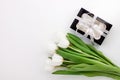 White tulip flowers and black gift box on light background flat lay. Place for text 8 March Happy Womens Mothers Day Royalty Free Stock Photo