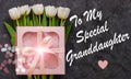 White tulip flowers and pink gift box dark background flat lay. To My special Granddaughter card sign text. I Love you Royalty Free Stock Photo