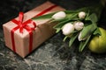 White tulip gift box green background Royalty Free Stock Photo