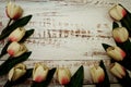 White Tulips bouquet with Space for text on a wooden background