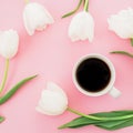 White tulips flowers with mug of coffee on pink background. Blogger composition. Flat lay, top view. Royalty Free Stock Photo