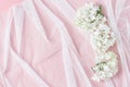 White tulle and beautiful hydrangea flowers. pink table background. feminine wedding, birthday floral concept. top view, copy Royalty Free Stock Photo