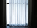 White Tulle curtains and dark floor