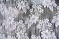 White tulle with embroidered flowers