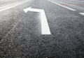 White turn left arrow on the road Royalty Free Stock Photo