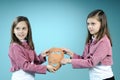 White twin sisters showing handmade masque