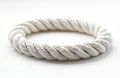 White twisted rope forms a circle on a white background. This design element showcases texture and detail. It is perfect for Royalty Free Stock Photo