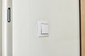 white two-key switch on the wall close-up Royalty Free Stock Photo