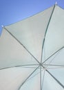 White umbrella blue sky
