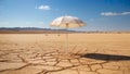 White umbrella in an arid desert Royalty Free Stock Photo