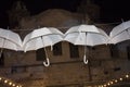 White umbrellas on the background of an abandoned building. old wall. white umbrellas. background