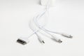 White universal charging cable, adapter with micro USB, usb connectors for different models of phones and devices Royalty Free Stock Photo