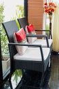 White upholstered chair in living room with flowers