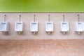 White urinal in men`s bathroom. Royalty Free Stock Photo