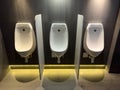 White urinals in the men's toilet Royalty Free Stock Photo