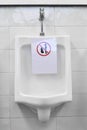 White urinals with symbol disallowing in the men public toilet Royalty Free Stock Photo