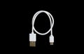 White USB cable on black background. Royalty Free Stock Photo