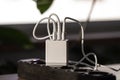 White USB charging for gadgets on a blurred background of the room, close-up. Royalty Free Stock Photo