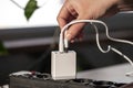 White USB charging for gadgets on a blurred background of the room, close-up. Royalty Free Stock Photo