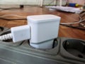 White USB charging for gadgets on a blurred background of the room, close-up Royalty Free Stock Photo